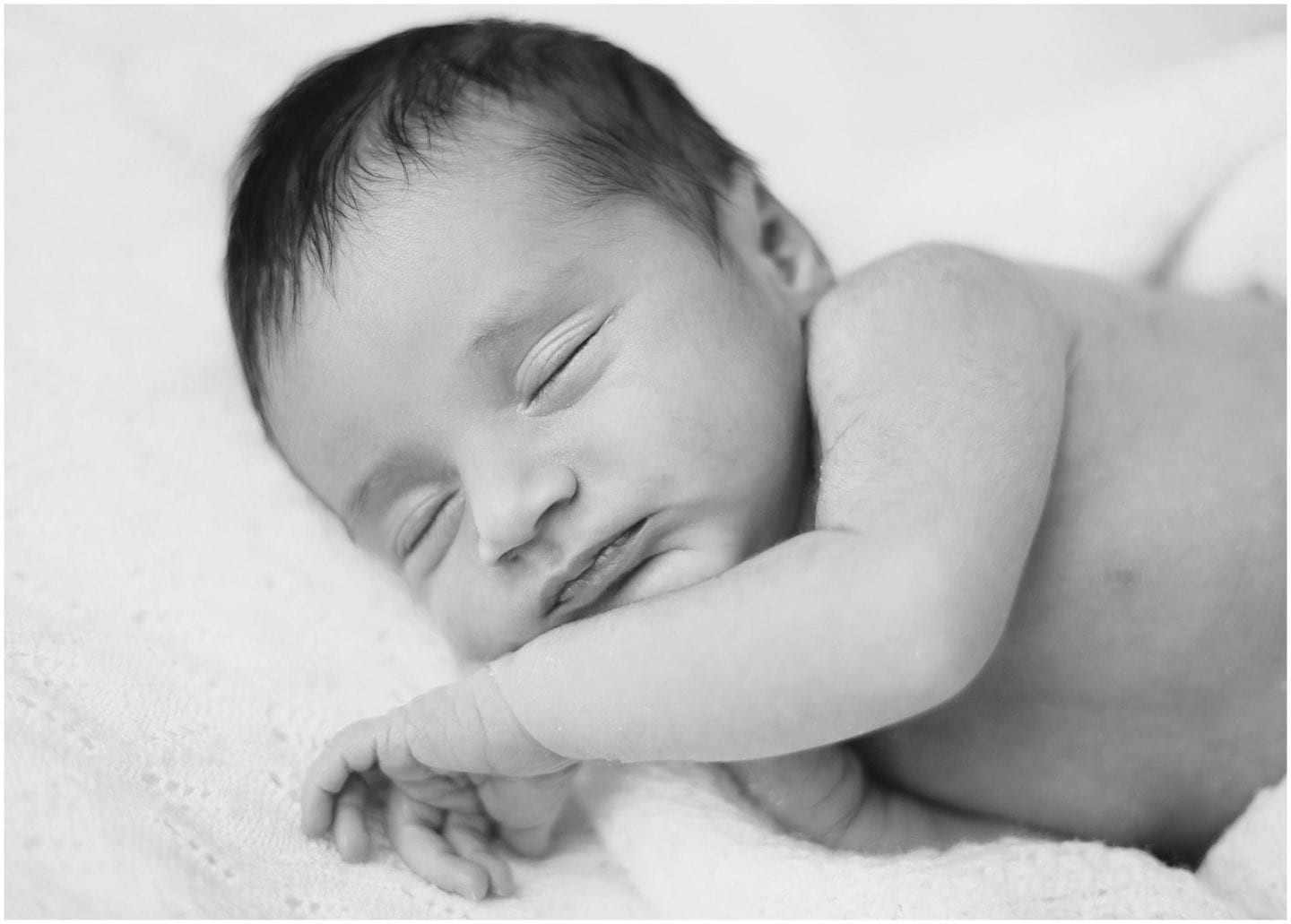 timeless black and white portrait of newborn baby sleeping