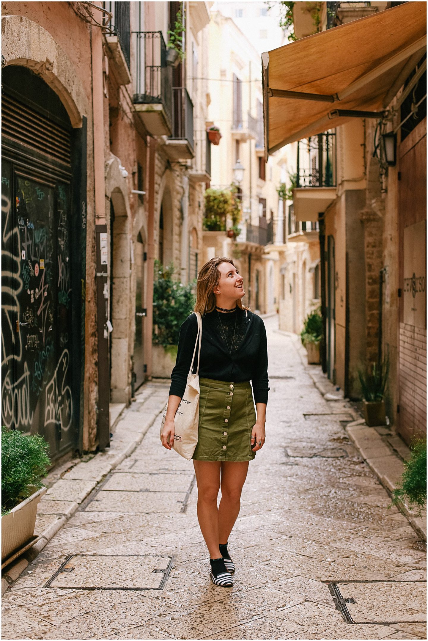 Helena Woods photographer walking in Bari's Old Town in Puglia Italy