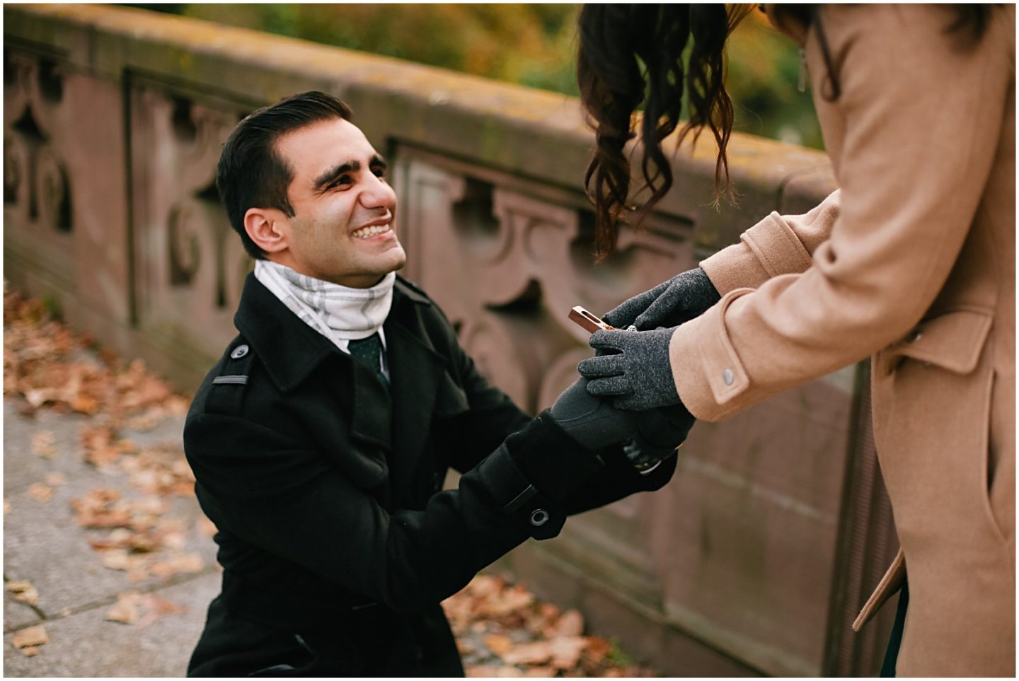 man proposes to his girlfriend in the fall
