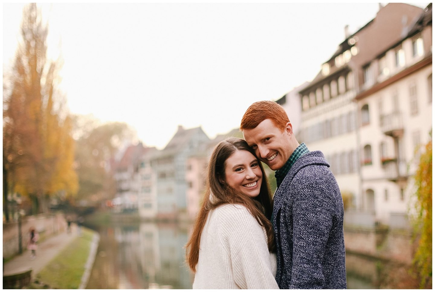 couple smiling in Strasbourg Petite France for engagement photoshoot