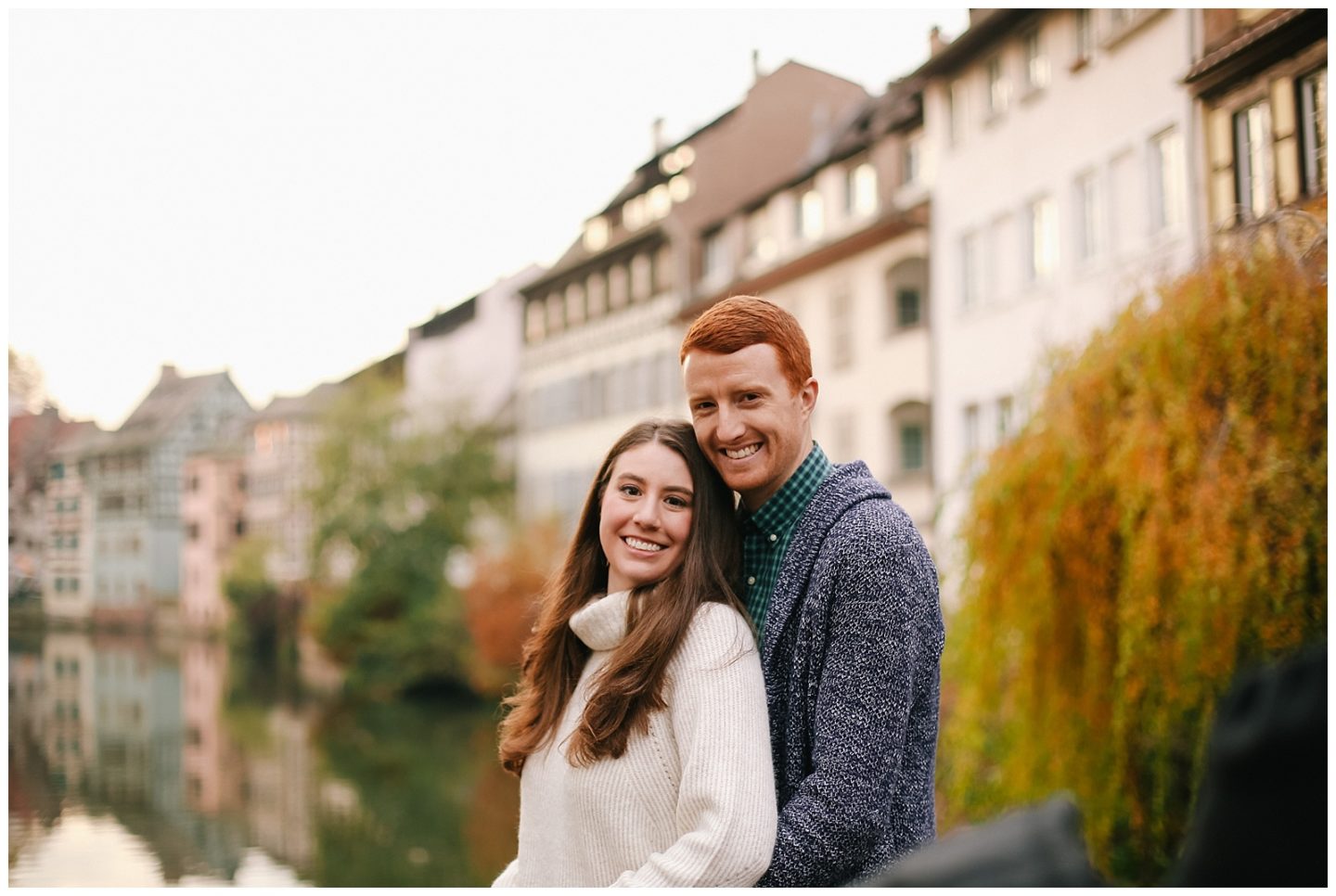 couple smiling in Strasbourg Petite France for engagement photoshoot