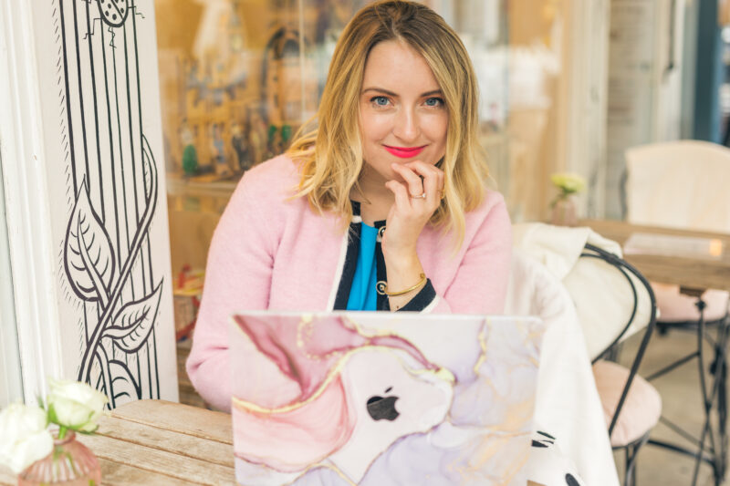 astrocartographer astrologer on laptop in cafe doing an astrology reality tv dating show