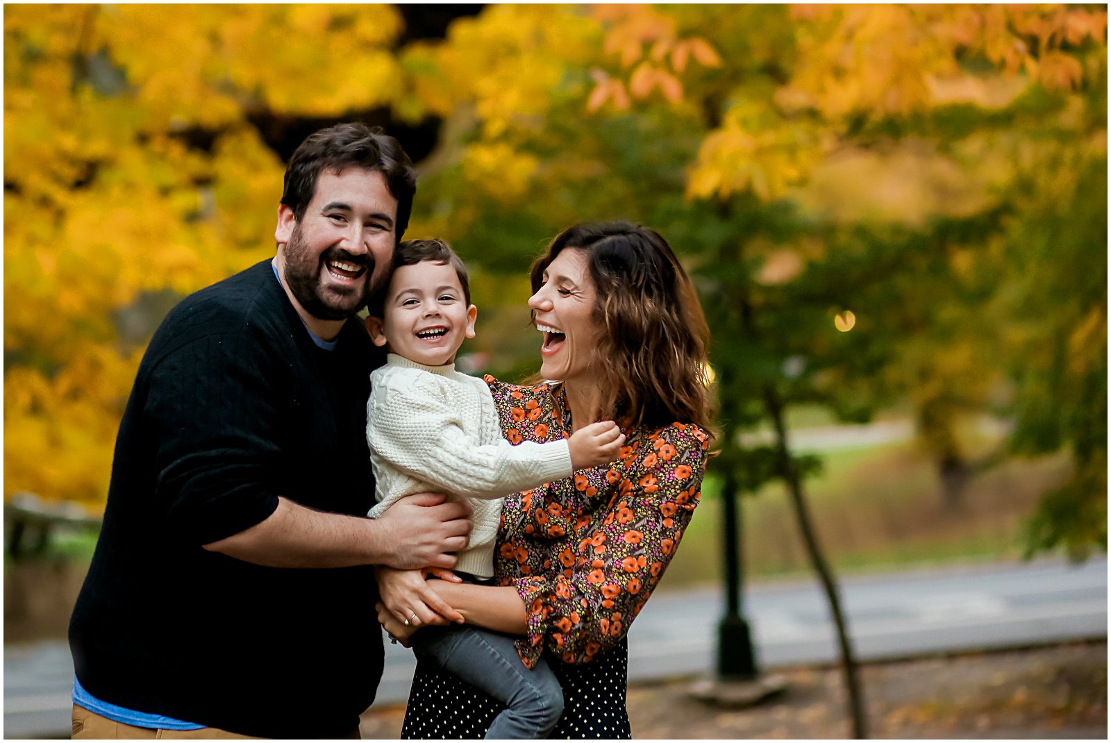 family in fall leaves with Fairfield CT family photographer Helena Woods