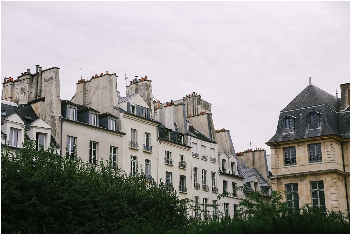 Helena Woods american expat in Paris, white building facade