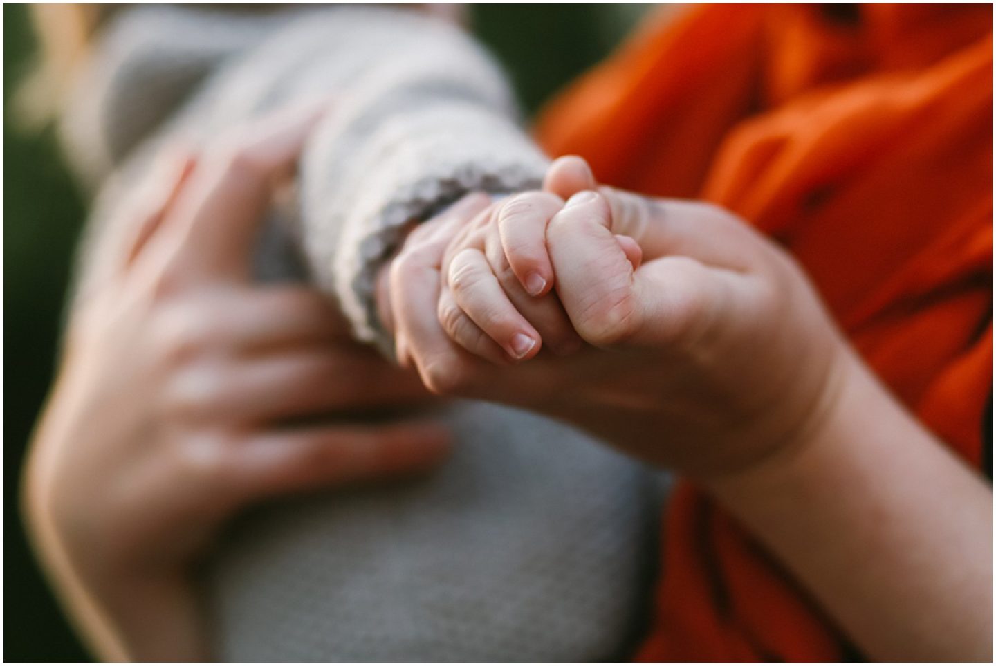 baby and mother holding hands family photographer