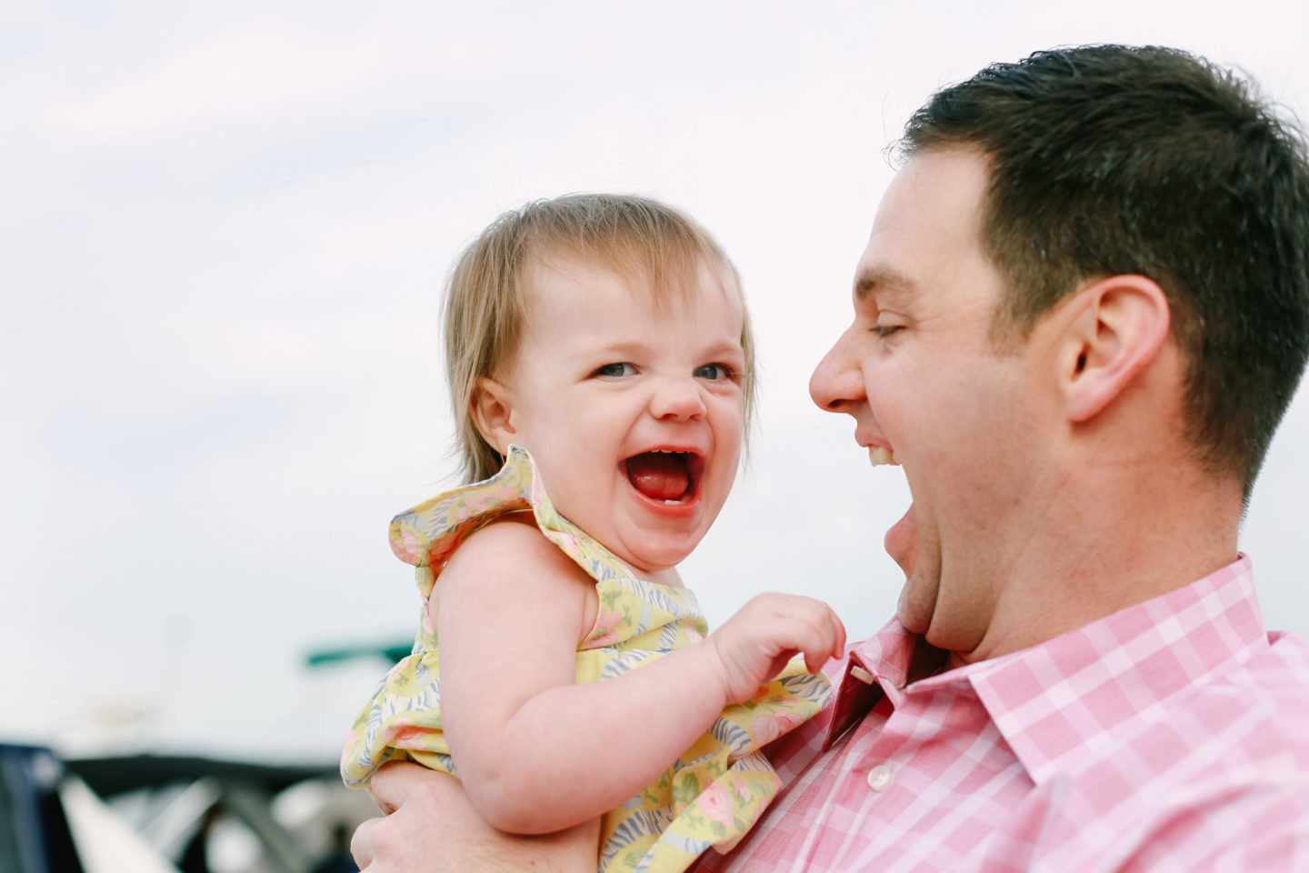 baby girl and dad laughing in Connecticut with family photographer