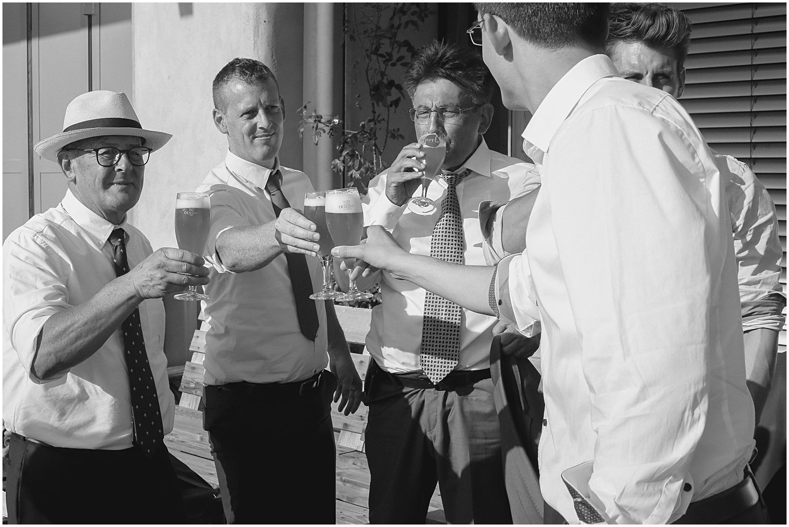 groomsmen drinking at wedding reception photographed by Helena Woods