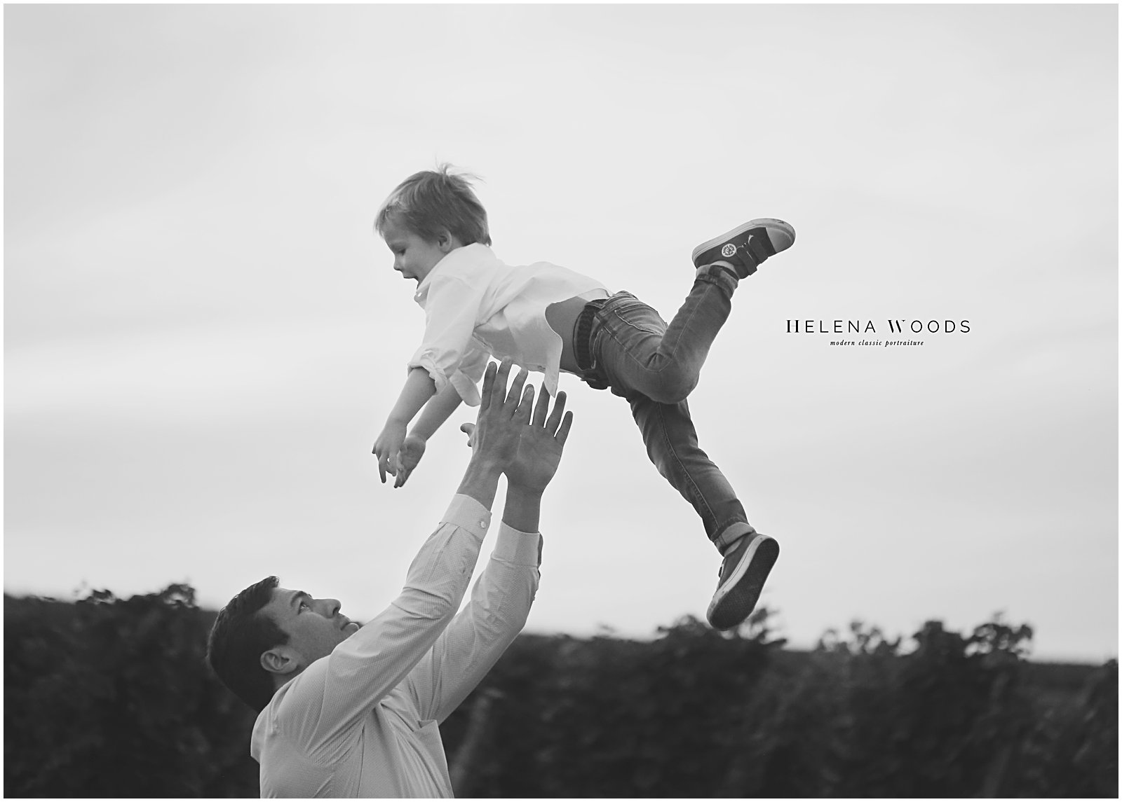 father and son jumping with destination family photographer helena woods