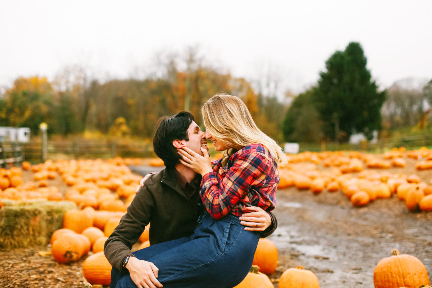 newlywed couple kissing in pumpkin patch in fairfield connecticut