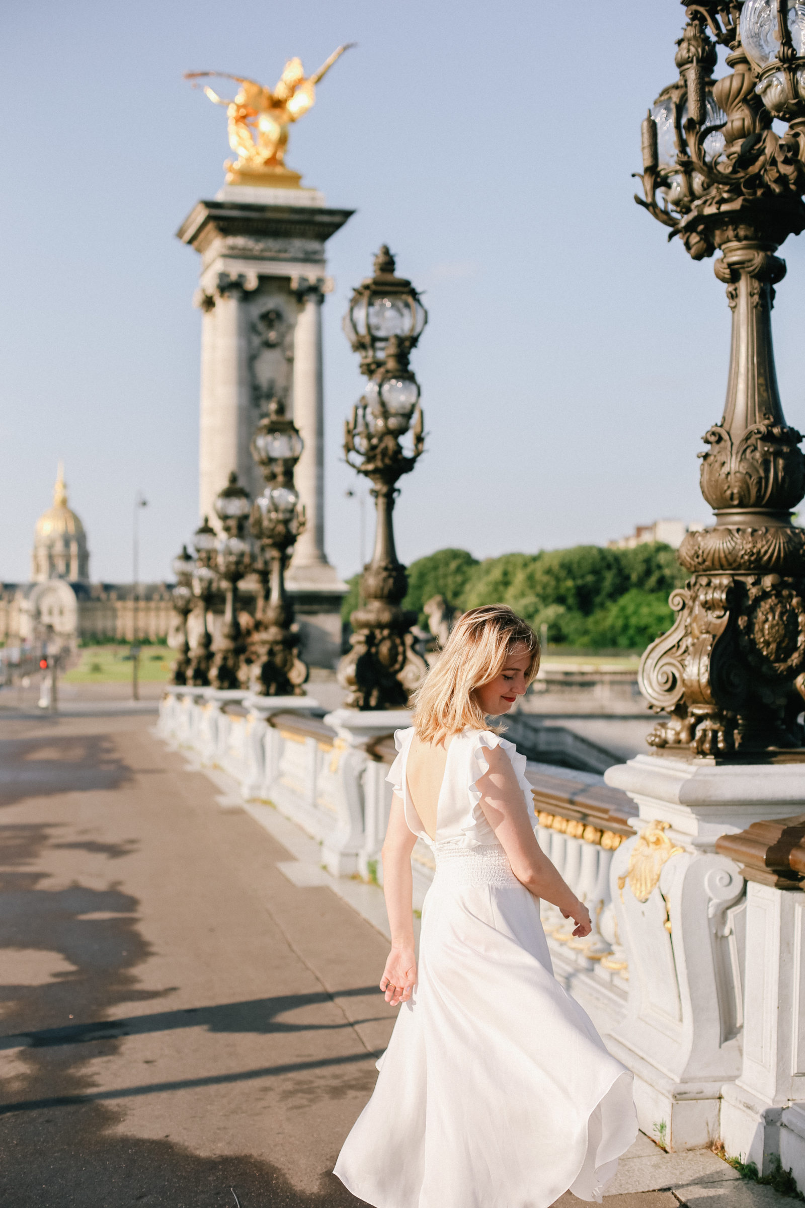 girl wandering pont alexandre bridge in paris france