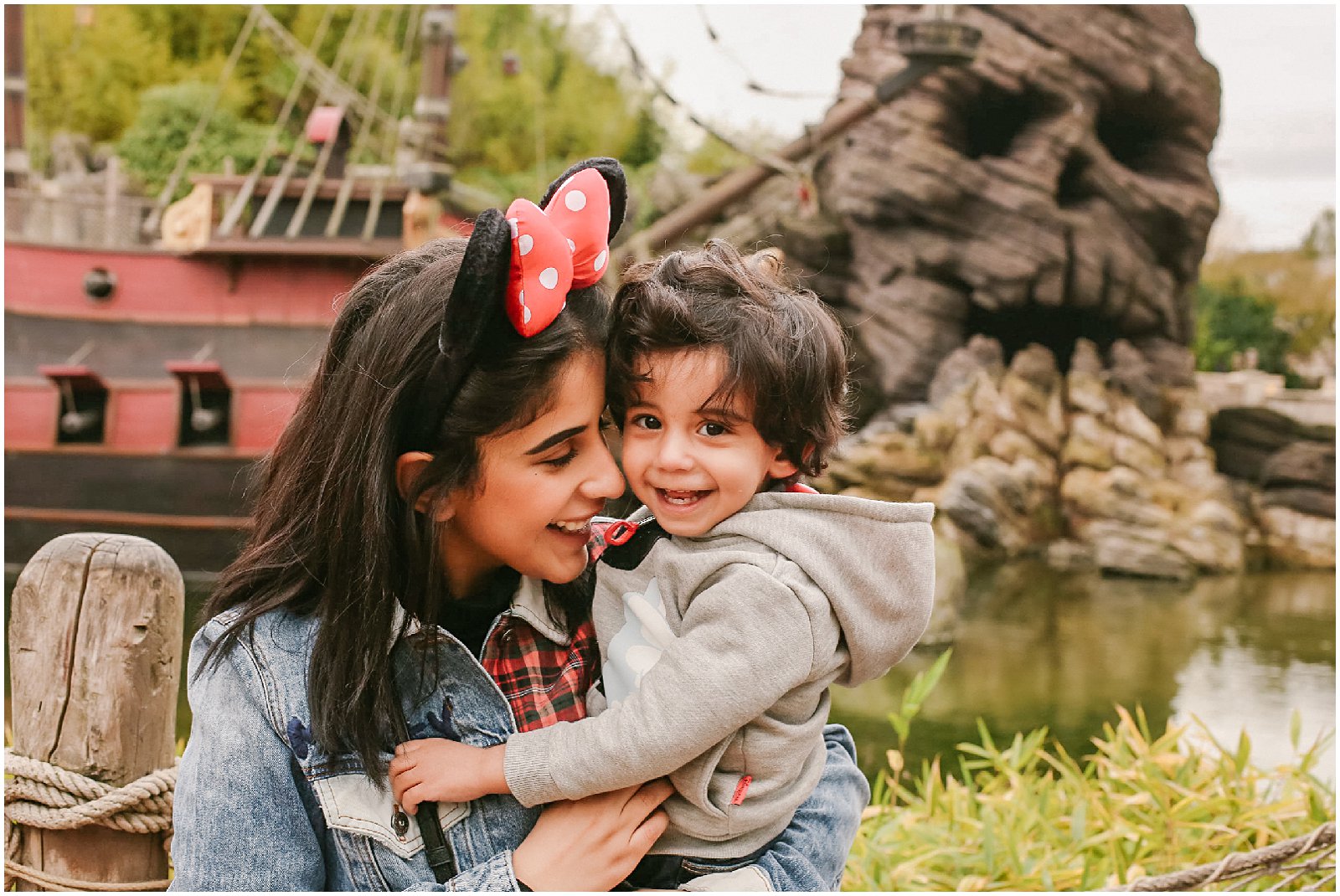 mother and son laughing with photographer at Disneyland Paris