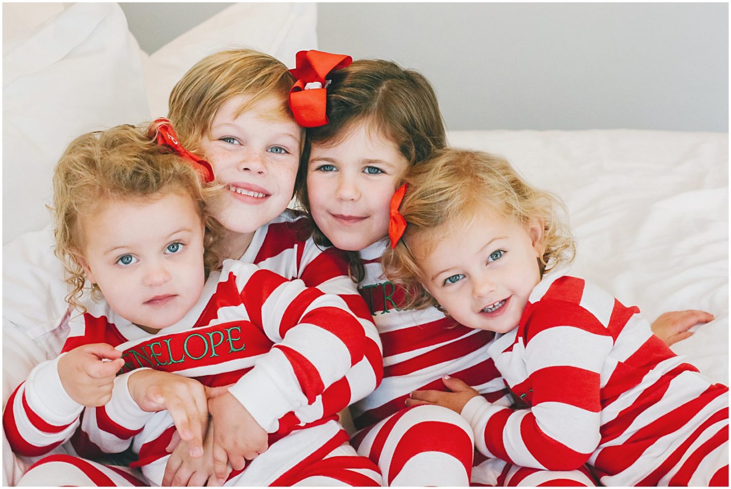 children dresses in matching christmas pajamas at home with lifestyle family photographer Helena Woods