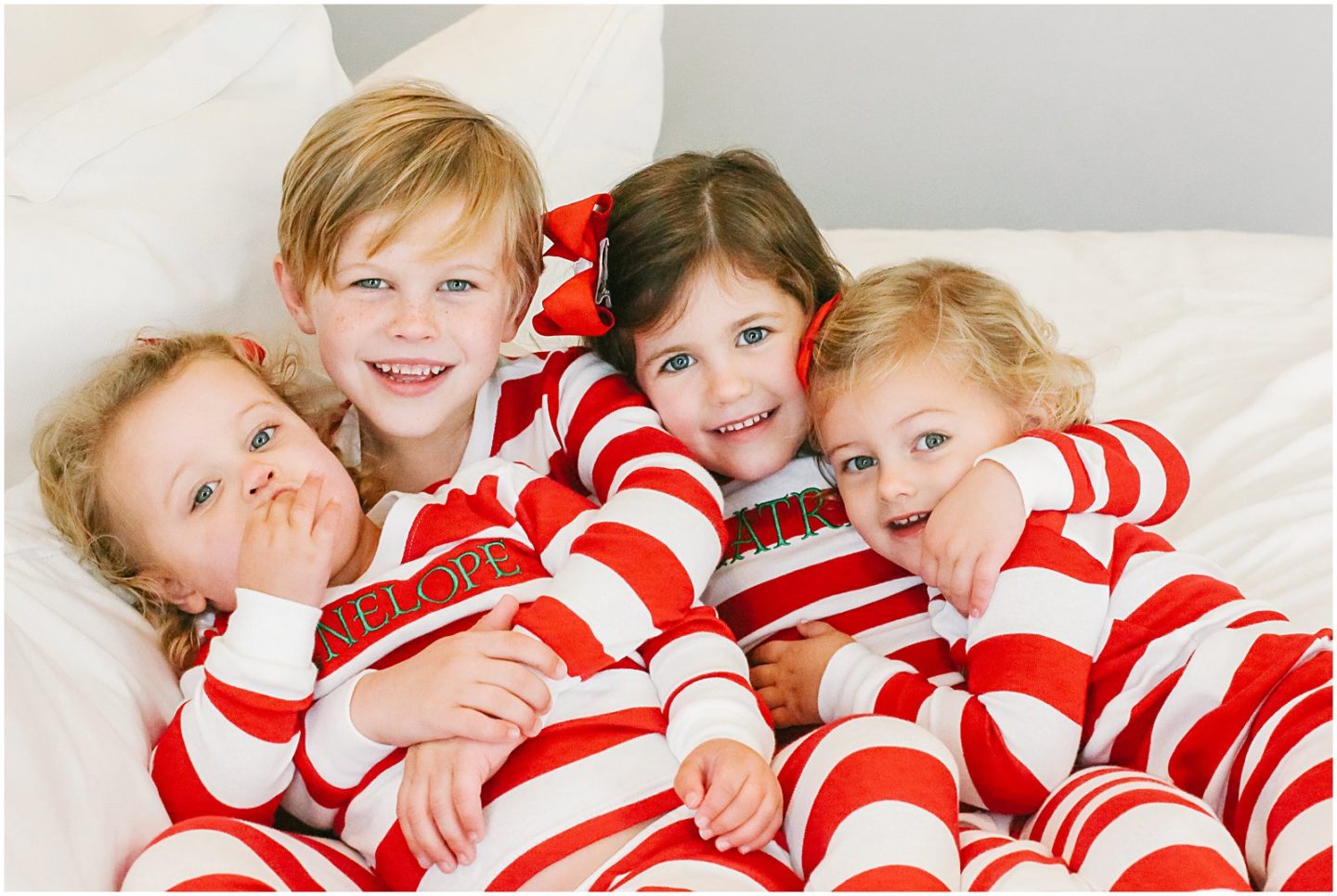 children matching christmas pajamas at home with lifestyle family photographer Helena Woods