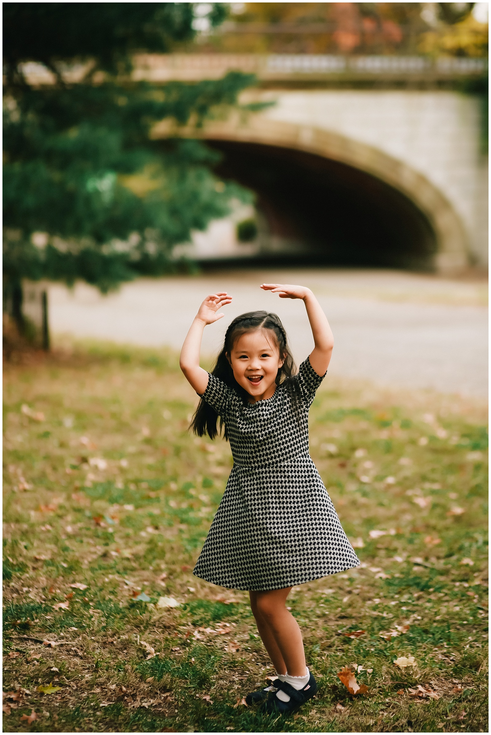 little girl dancing in central park with nyc family photographer helena woods