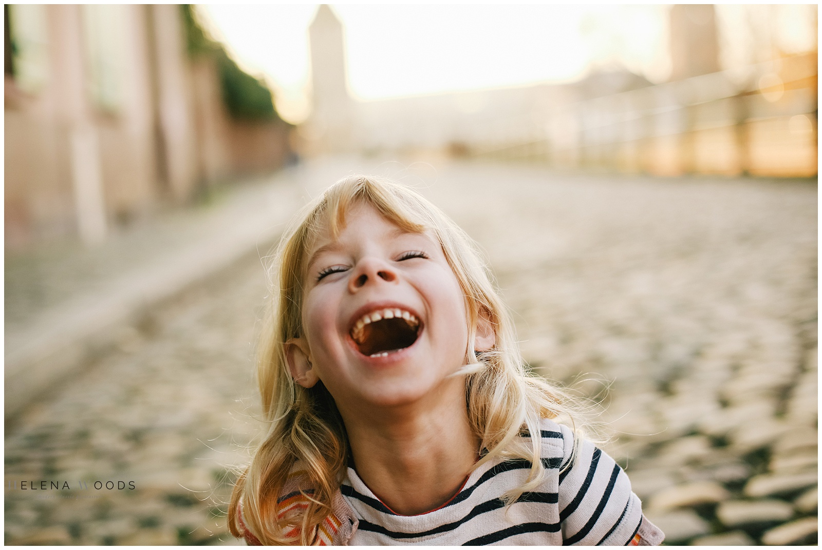 little girl laughing in Strasbourg France | Helena Woods Photography