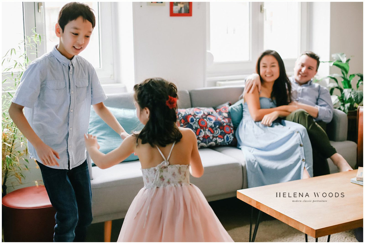 kids dancing in living room during lifestyle home family photos with Helena Woods Photography